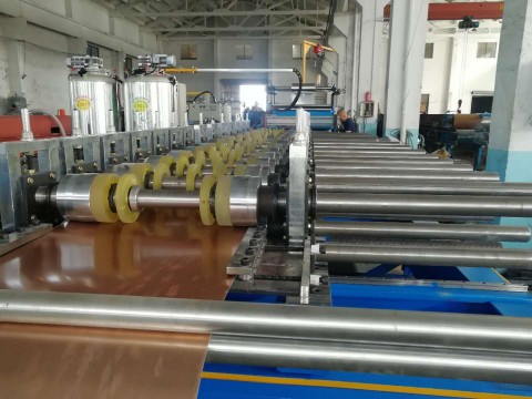 Decorative panel roll forming machine