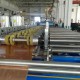 Decorative panel roll forming machine